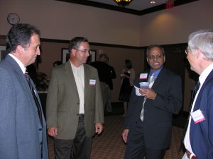 Rakesh Agrawal, the 2008 Founder's Lecturer, mingling with attendees.