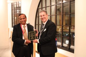 Professor George Huber with founders lecture, Anil Oroskar.